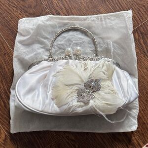 Elegant White Clutch with Feather and Rhinestone Detail